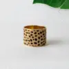 A wide, solid cuff bracelet